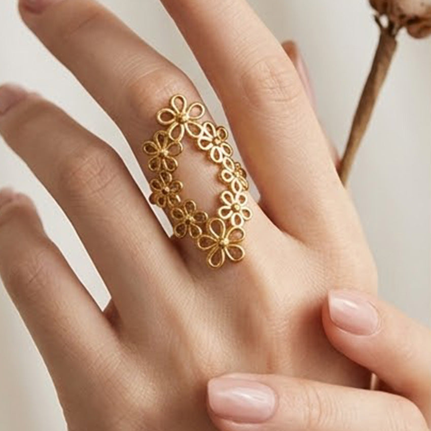 Front view of an 18K gold plated stainless steel floral wreath ring