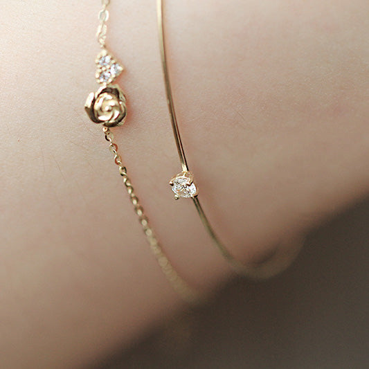 Pulsera con forma de rosa pequeña y corazón de circonitas en plata 925. Juego de 10