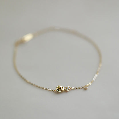 Pulsera con forma de rosa pequeña y corazón de circonitas en plata 925. Juego de 10