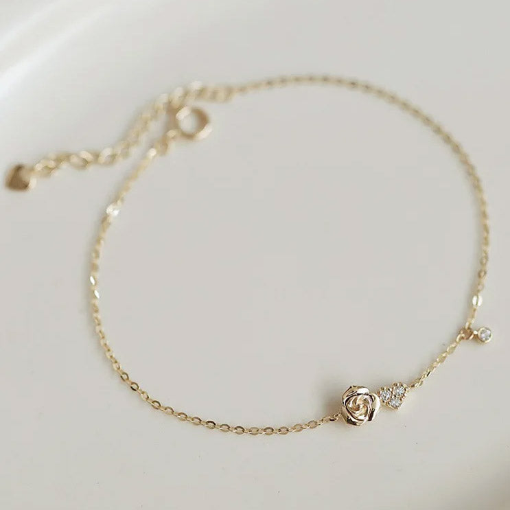 Pulsera con forma de rosa pequeña y corazón de circonitas en plata 925. Juego de 10