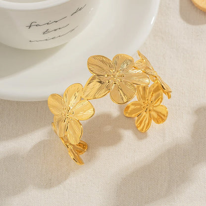 Pulseras anchas de acero inoxidable con flores doradas para mujer, juego de 10