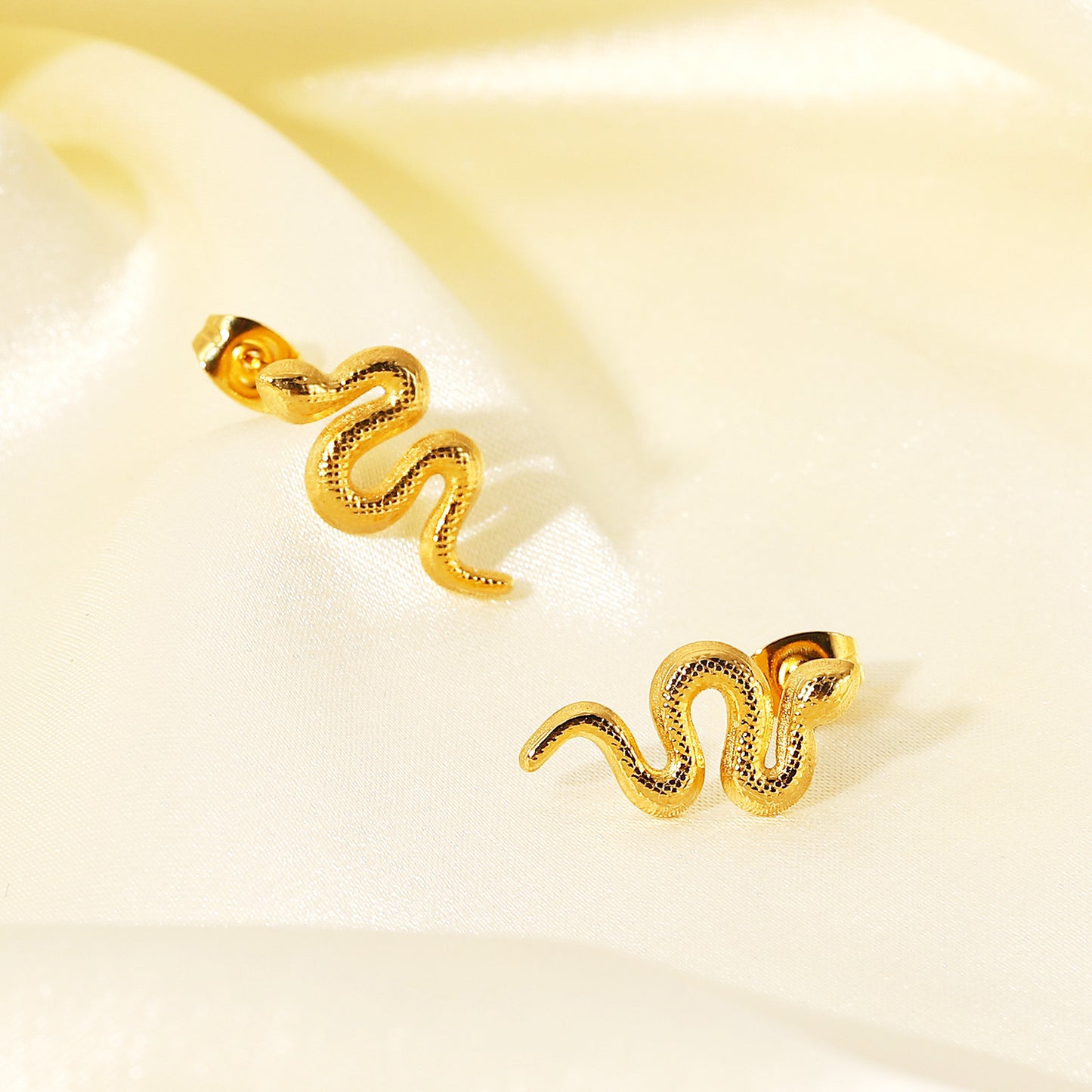 Stainless steel gold distorted snake stud earrings (5 pairs)