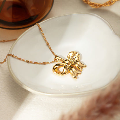 Stainless steel gold plated ribbon bow pendant necklace Set of 5