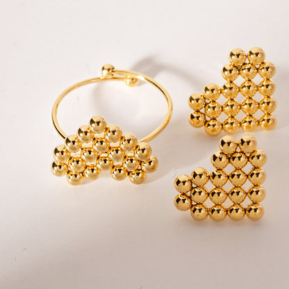 Anillos ajustables de acero inoxidable con forma de corazón y cuentas doradas. Juego de 10