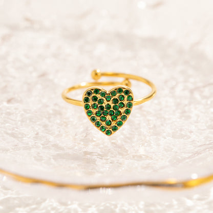 Anillos ajustables de acero inoxidable con corazón de circonita verde y pavé de oro. Juego de 10