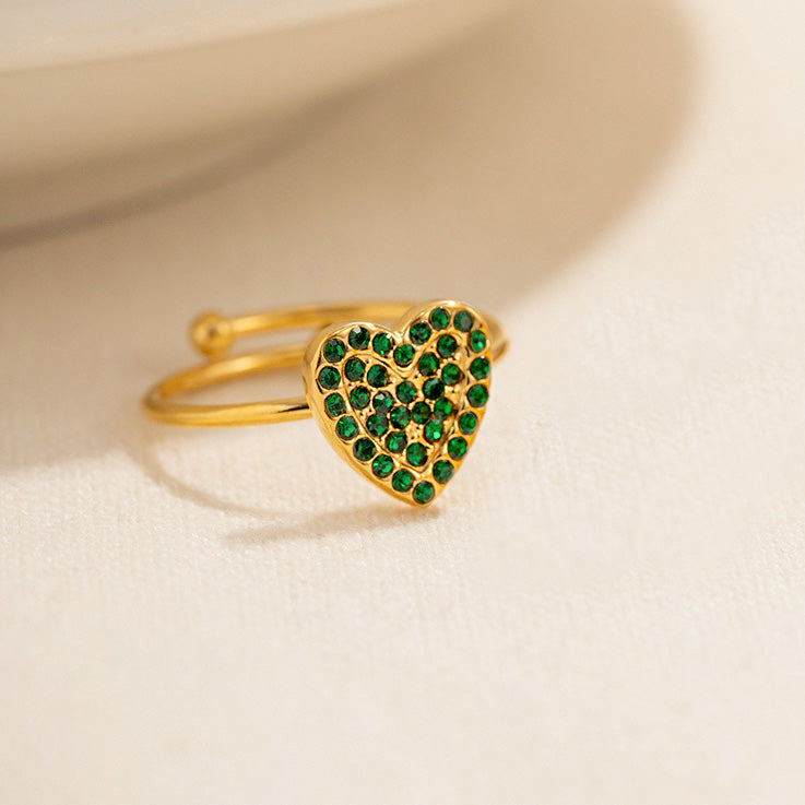 Anillos ajustables de acero inoxidable con corazón de circonita verde y pavé de oro. Juego de 10