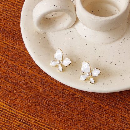 Small white enamel butterfly with pearl stud earrings (5 pairs)