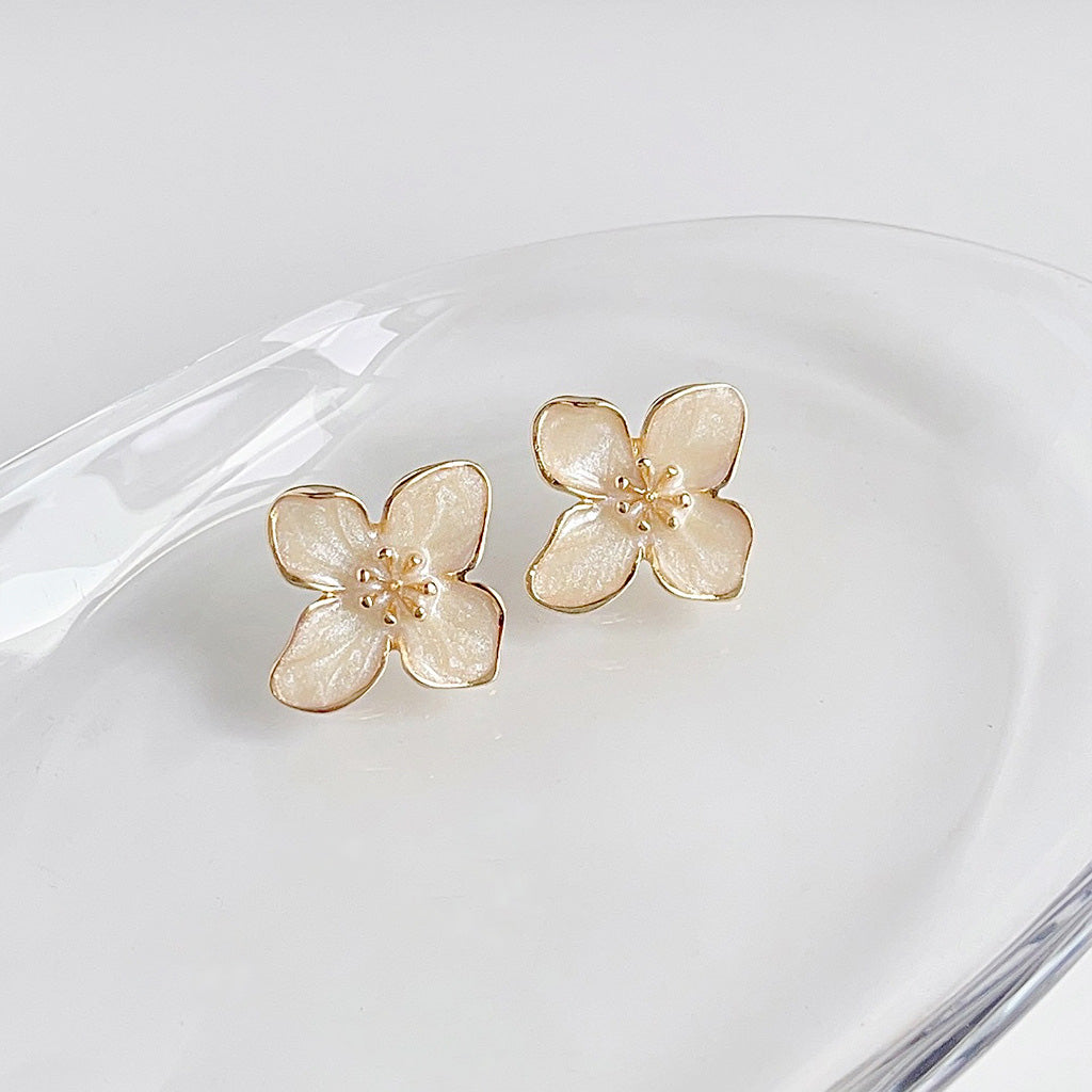 Gold plated white enamel flower stud earrings (5 pairs)