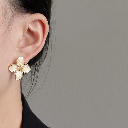 Gold plated white enamel flower stud earrings (5 pairs)