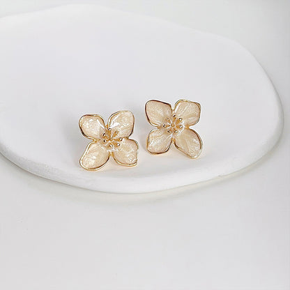 Gold plated white enamel flower stud earrings (5 pairs)