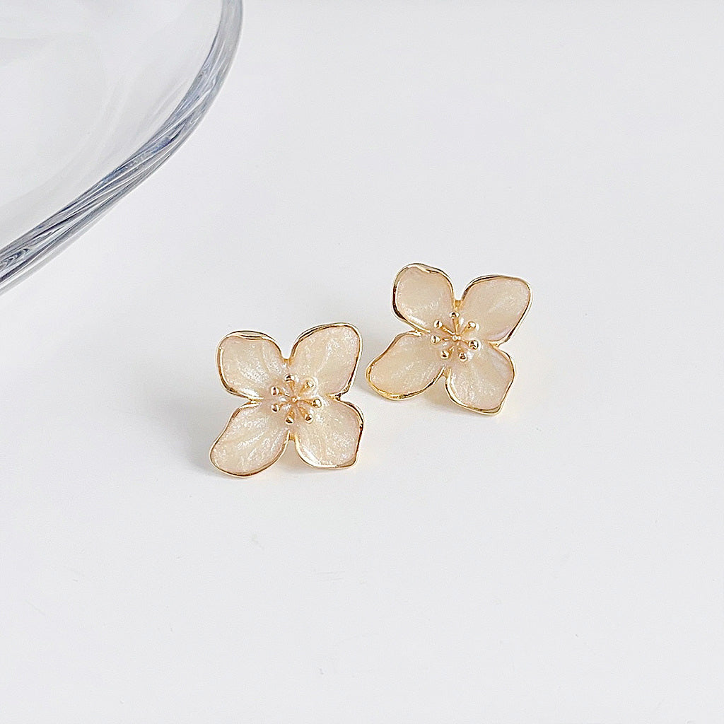 Gold plated white enamel flower stud earrings (5 pairs)