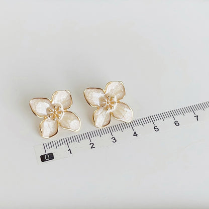 Gold plated white enamel flower stud earrings (5 pairs)