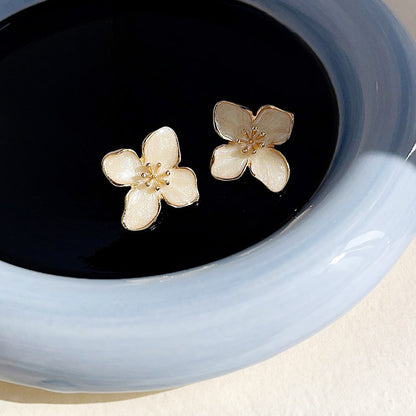 Gold plated white enamel flower stud earrings (5 pairs)