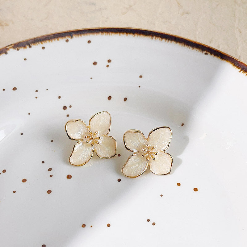 Gold plated white enamel flower stud earrings (5 pairs)