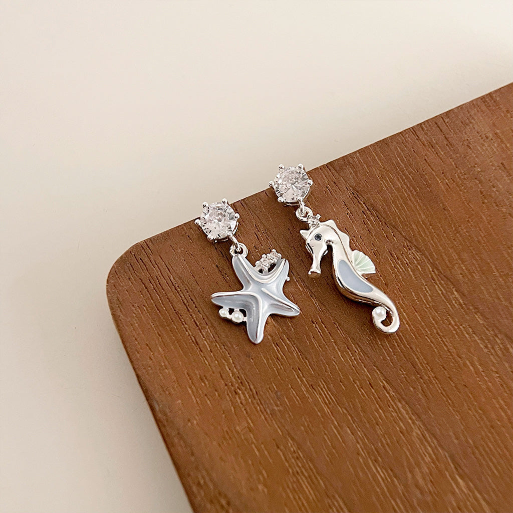 Light blue enamel starfish and seahorse asymmetrical drop earrings (5 pairs)