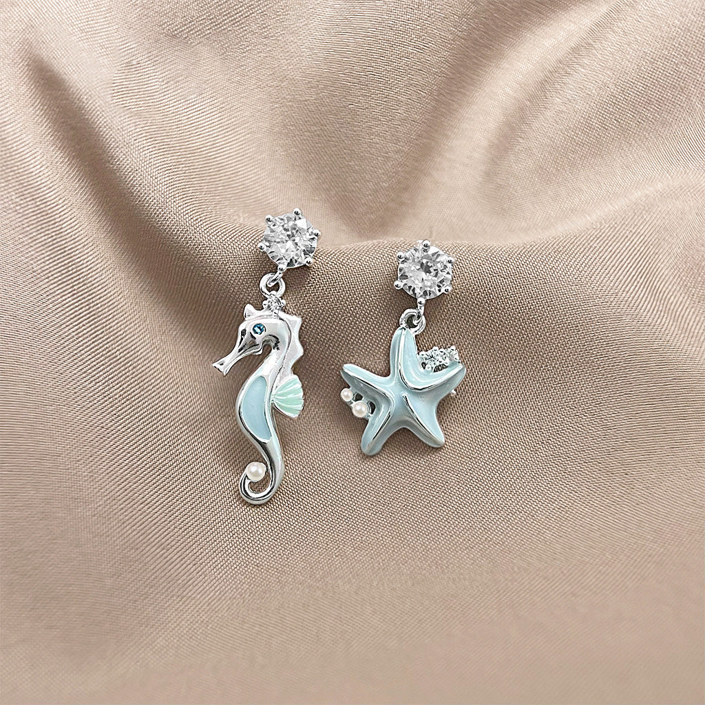 Light blue enamel starfish and seahorse asymmetrical drop earrings (5 pairs)