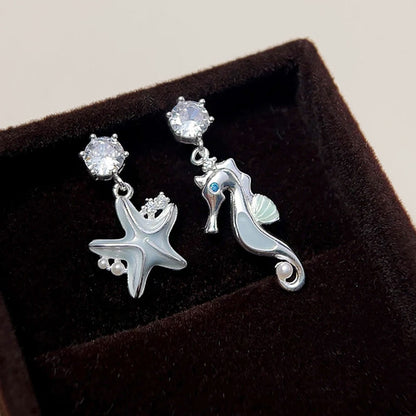 Light blue enamel starfish and seahorse asymmetrical drop earrings (5 pairs)