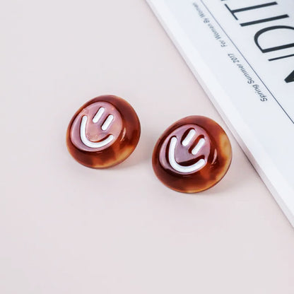 Brown acrylic smiley with white enamel button stud earrings (5 pairs)