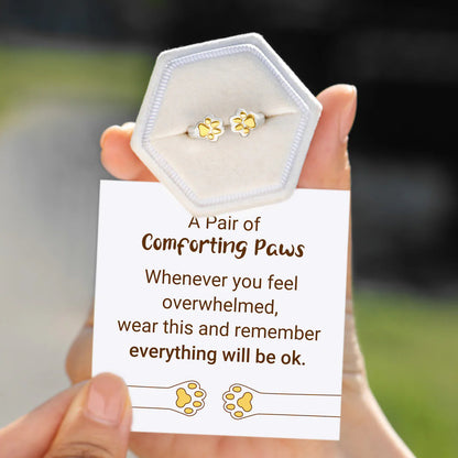 dainty pet jewelry ring with golden paw print detail and stackable silver band
