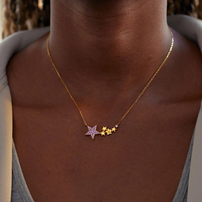 Elegant collarbone length sterling silver star necklace with colorful accents