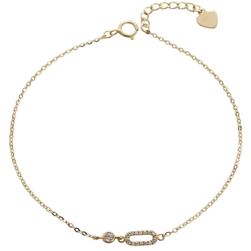 Geometric cubic zirconia bracelet for women in 14K gold plating on white background