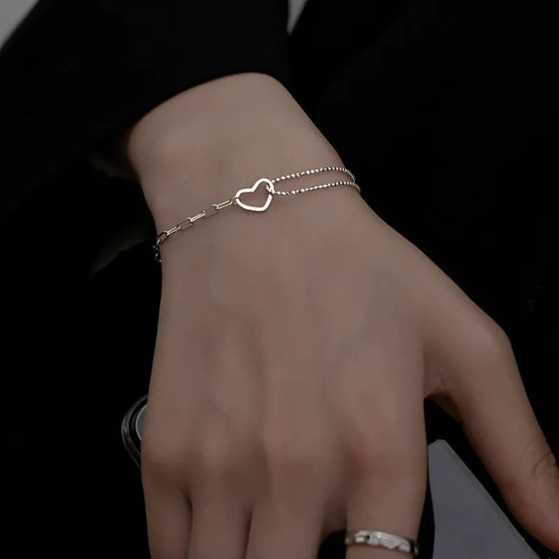 Close-up of silver open heart bracelet for women meaningful friendship or sister gift