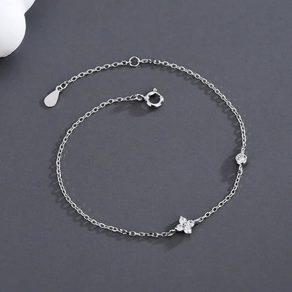 Dainty silver bracelet with four leaf clover charm for women, ideal birthday gift