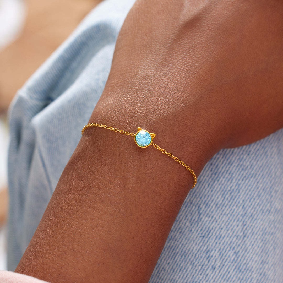 Gold cat bracelet with blue CZ stone, perfect jewelry gift for cat lovers and women