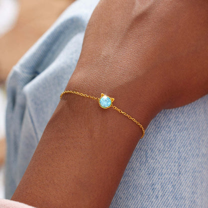 Gold cat bracelet with blue CZ stone, perfect jewelry gift for cat lovers and women