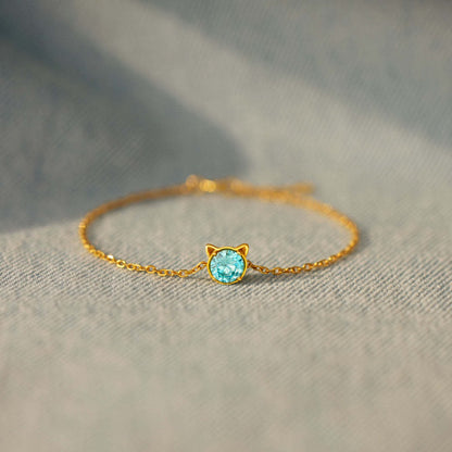 Dainty gold charm bracelet with cat ear motif and blue CZ, great birthday gift for her