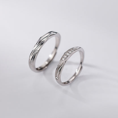 silver promise rings for couples with wave design and cubic zirconia stones