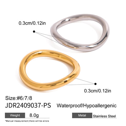 Close-up of two tone rings in gold and silver stainless steel finish, waterproof and hypoallergenic design for trendy stacking ring lovers.