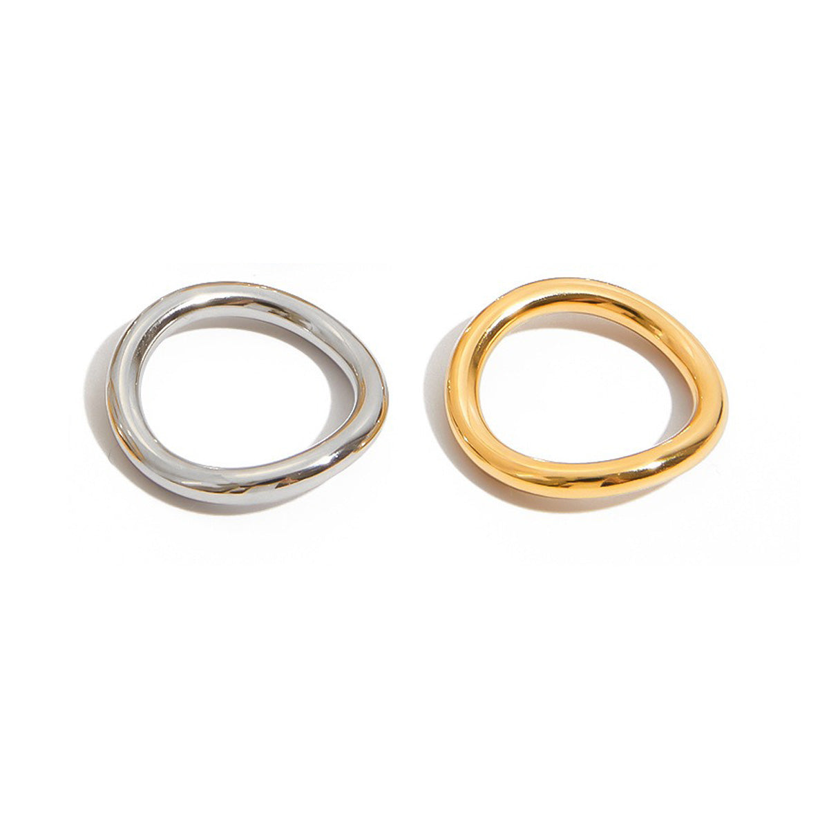 Gold and silver two tone stainless steel rings with organic wavy shape, perfect for minimalist stacking style and summer fashion jewelry.