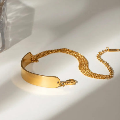 Elegant dainty chain bracelet gold style with polished surface and layered chains, showcasing a chic chain bracelet womens gold look for everyday or party wear.