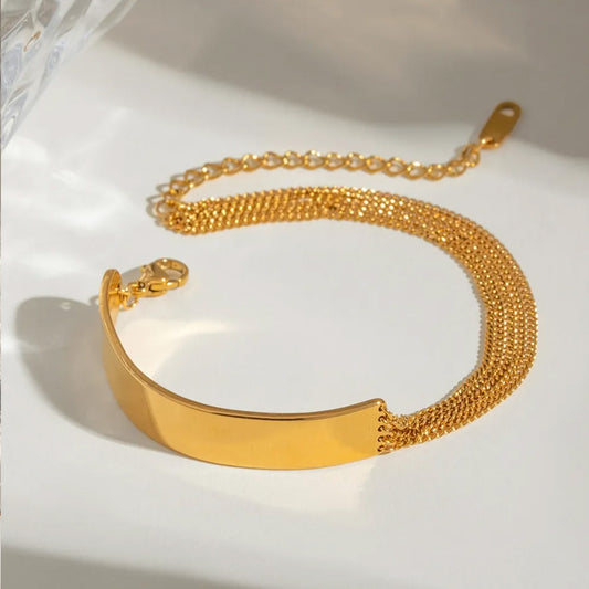  Minimalist gold cuban chain bracelet in stainless steel with multi-layered chain details, great as a chain bracelet womens gold gift or dainty fashion accessory.