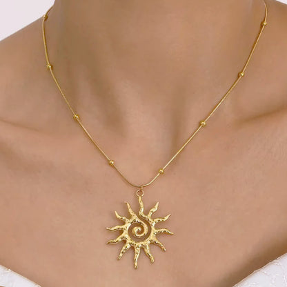 Layered sun pendant necklace styled with boho summer outfit, featuring 18k gold plated stainless steel necklaces for women’s summer jewelry looks.