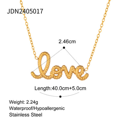 Model wearing a gold love letter necklace with dainty chain design, a romantic stainless steel waterproof choker for her.