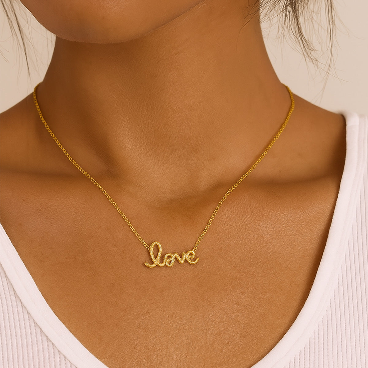 Flat lay of two gold necklaces including the gold love letter necklace, perfect as a Valentine’s Day necklace for her or romantic gift.