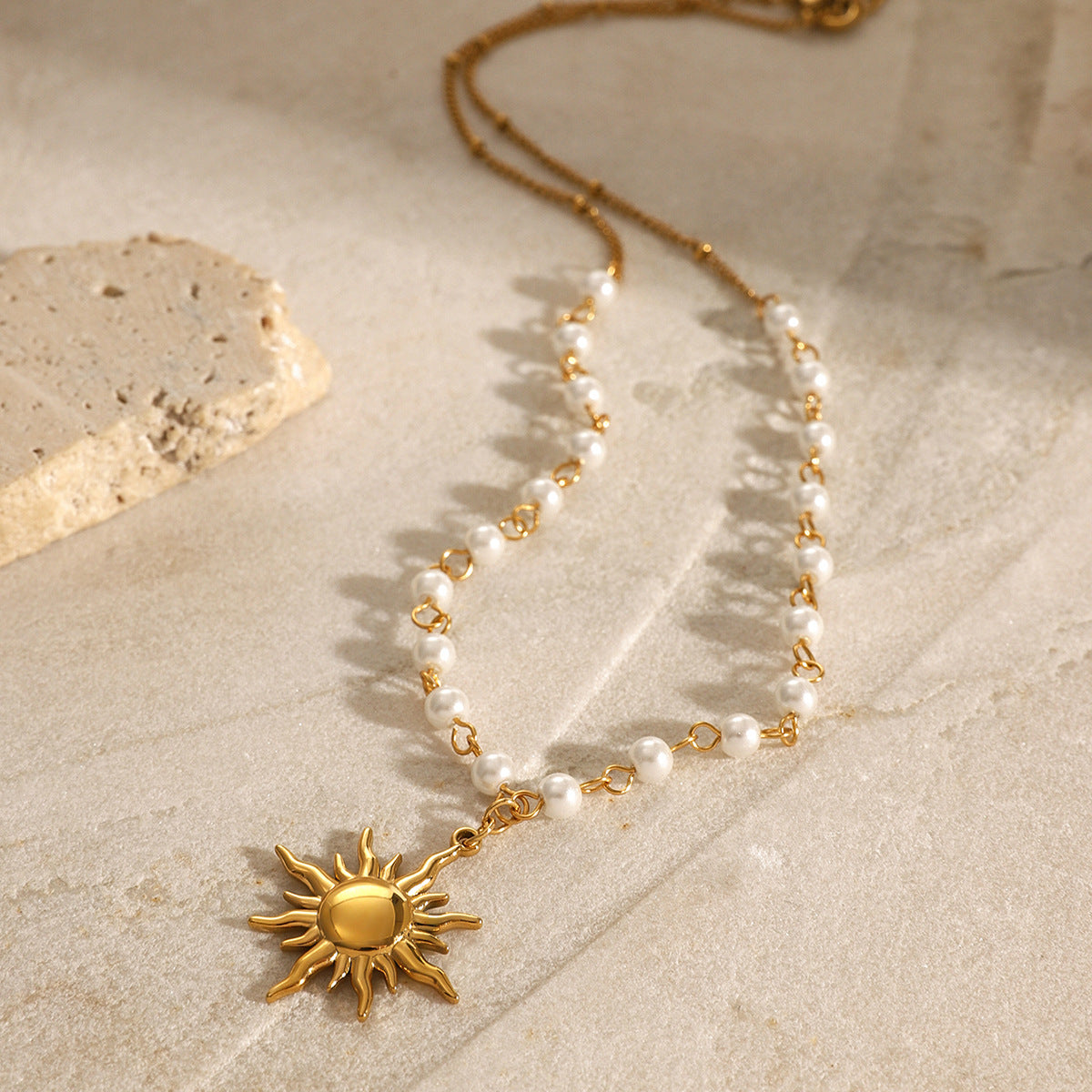 Close-up of dainty gold sun pendant pearl necklace with waterproof stainless steel chain – perfect for y2k aesthetic jewelry and bohemian pearl necklace lovers. Designed by a professional jewelry manufacturer for wholesale and boutique supply