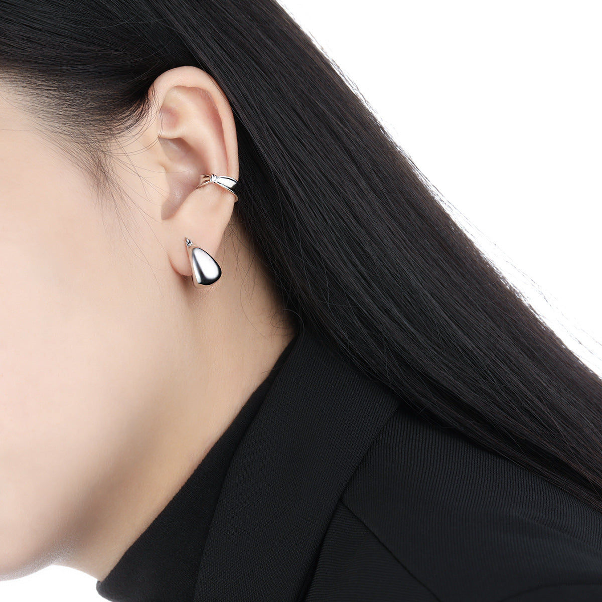 Model wearing wholesale chunky white gold plated 925 silver hoop earrings for women