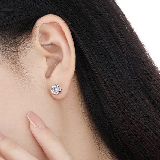 Model wearing large cubic zirconia stud earrings in 925 silver for women minimalist style wholesale jewelry.