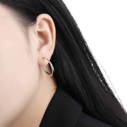 Model wearing 20mm white gold plated 925 sterling silver hoop earrings for wholesale buyers