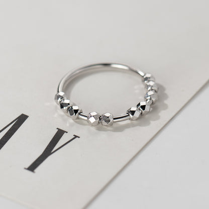 S925 sterling silver disco bead ring worn on finger with reflective faceted bead design