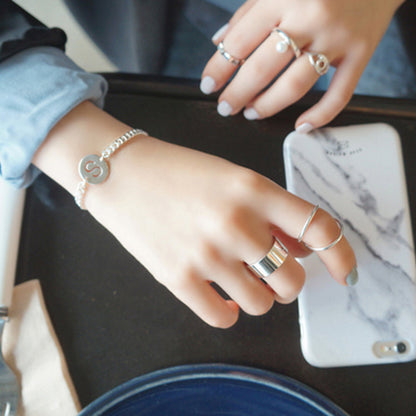 925 silver wide ring worn with minimalist stack rings, perfect for minimalist jewellery wholesale collections