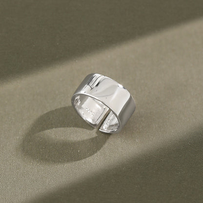 adjustable 925 silver wide band ring displayed in natural light, shining everyday jewelry for wholesale customers