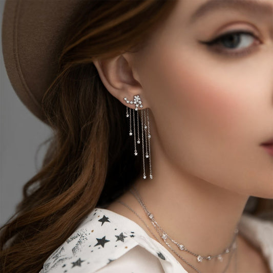 Elegant fashion jewelry wholesale image showing cubic zirconia star tassel drop earrings in 925 sterling silver, long chain design for women.