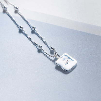 Back view of wholesale 925 silver black heart square pendant necklace showing 925 stamp