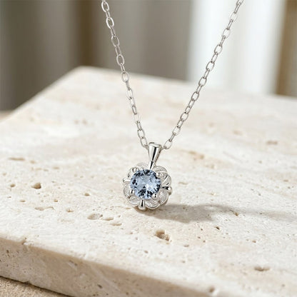 925 silver blue flower zircon necklace displayed on stone background with polished silver finish