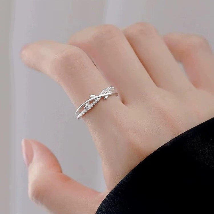 S925 sterling silver leaf open ring worn on hand with crossed branch design