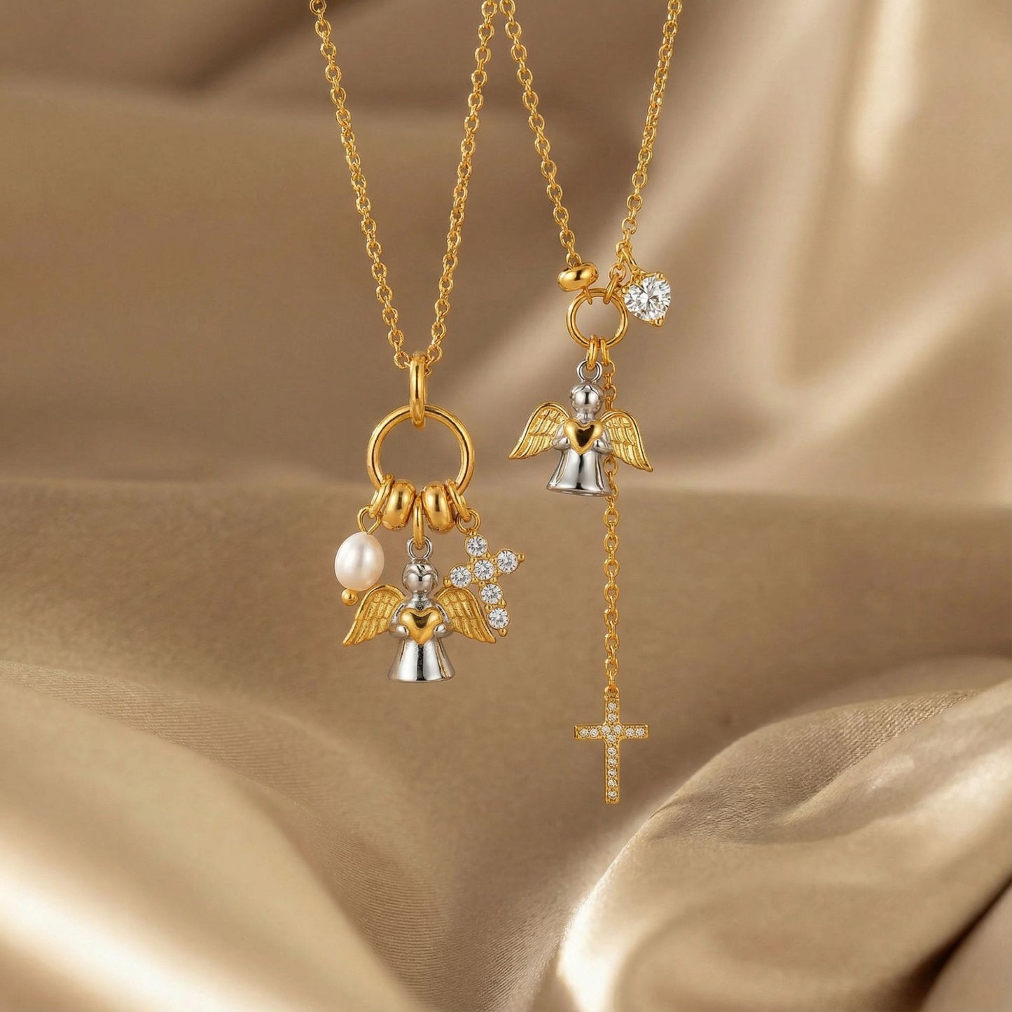 Close up of angel wings charm cluster with pearl style bead zircon letter charm and cross pendant